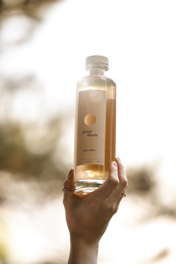sb_bottle_hand Sunset Bloom